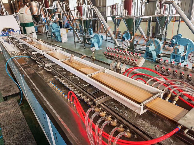 Qingdao Sure Plastic Machinery's wood plastic floor production line has successfully completed the trial run