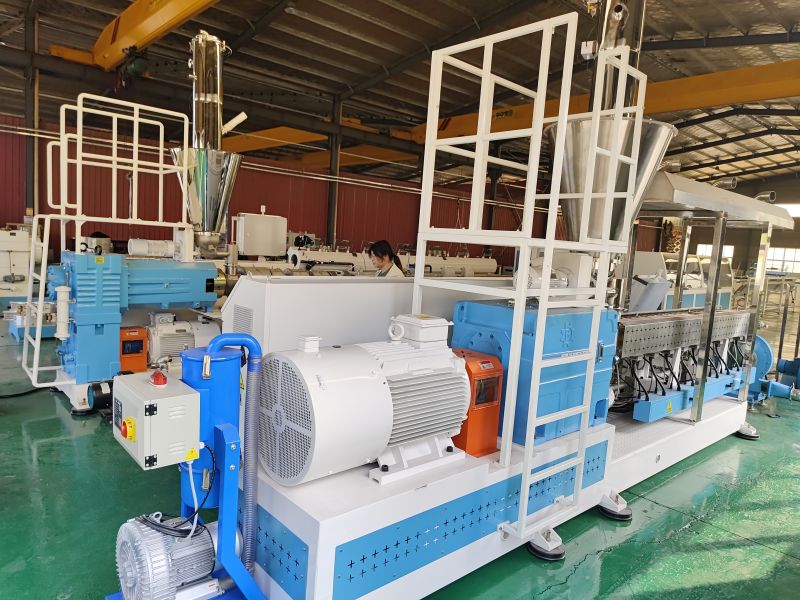 Why does Sure equip direct-coupled reducers for wood-plastic extruders?